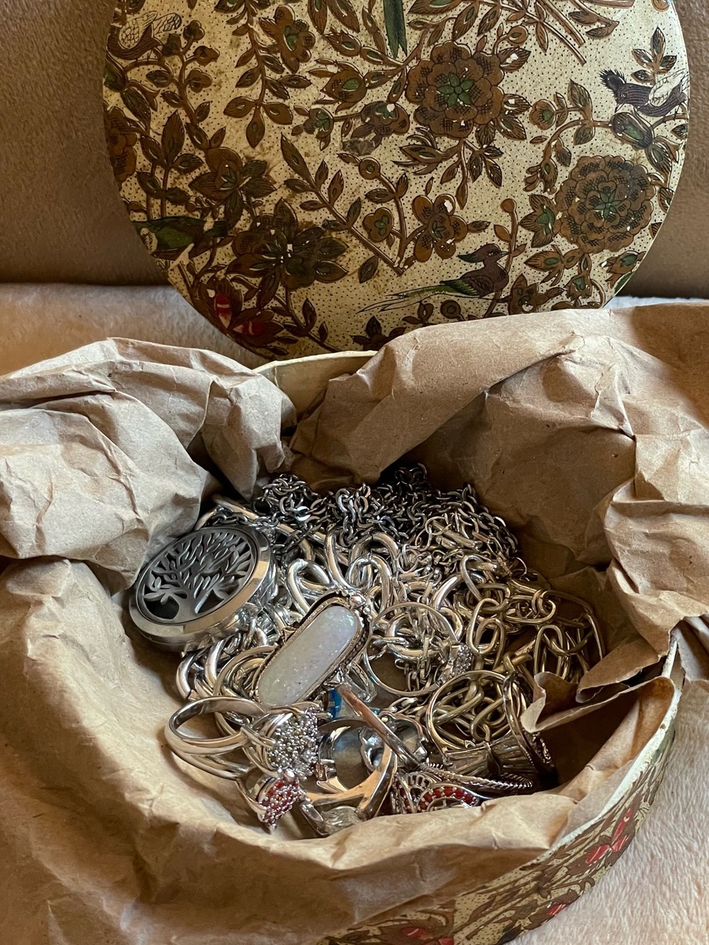 Silver tone fashion rings and necklaces in a vintage Japanese hard/paper box.